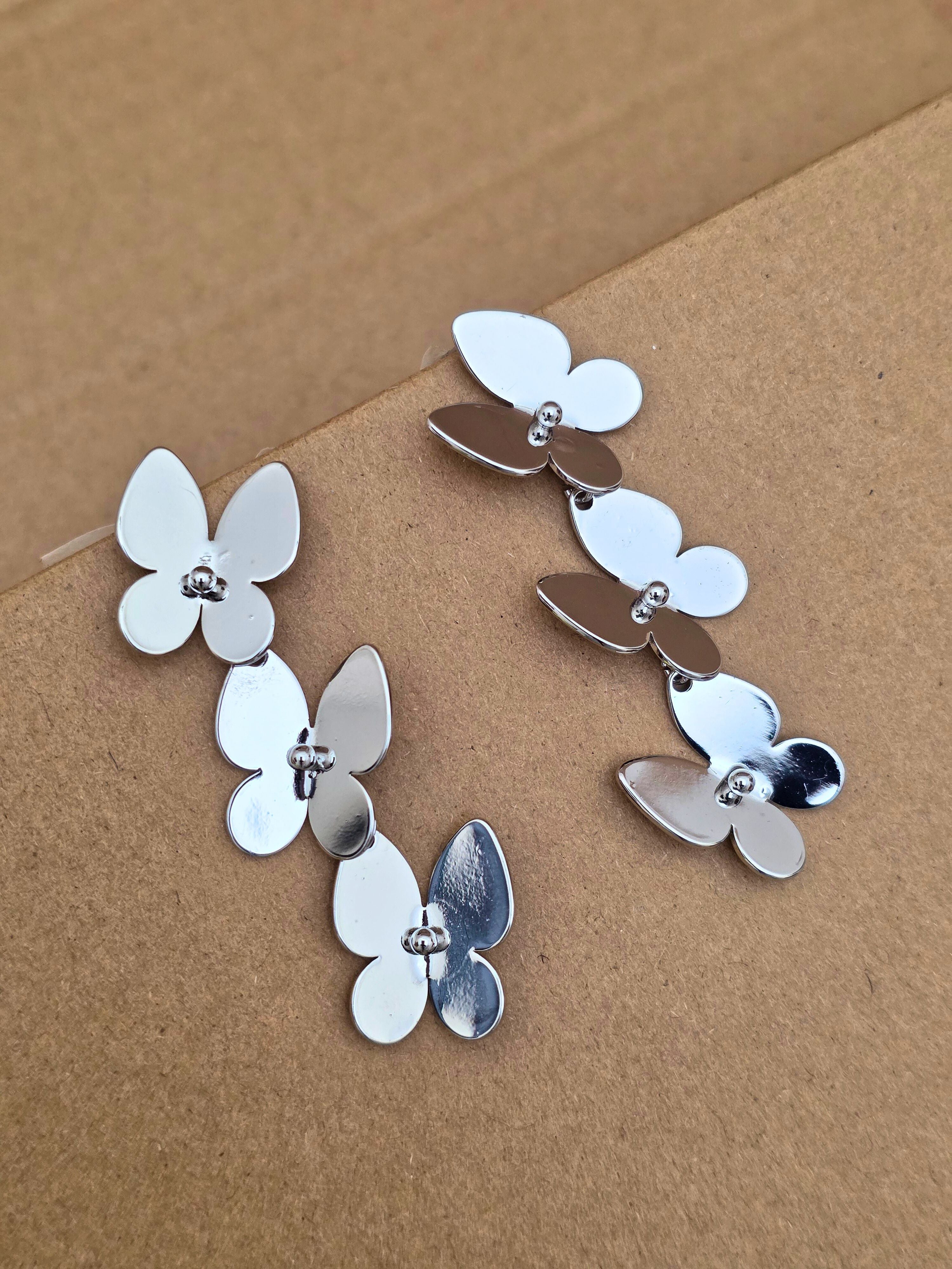 Sleek Silver-Toned Butterfly Hoop Earrings